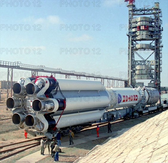 Baikonur, kazakhstan, april 25, 2003, rocket carrier proton-m (in pic) with the briz-m acceleration unit being transported to the launching pad of baikonur cosmodrome, proton, carrying the us ams 9 communications satellite, is to blast from baikonur on april 28.