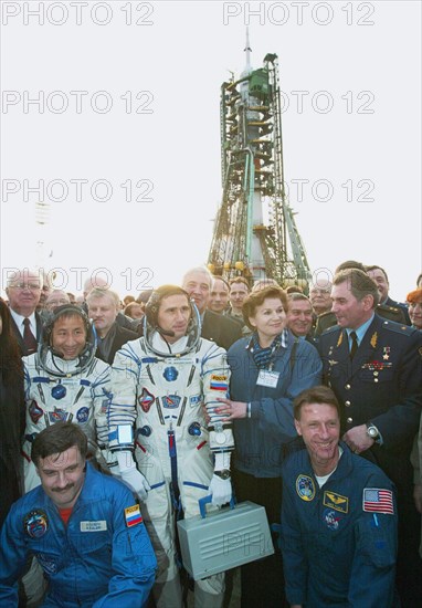 Baikonur, kazakhstan, april 26, 2003, the crew of the russian-u,s, seventh mission of the international space station, russian cosmonaut yuri malenchenko (background 2nd l) and nasa astronaut edward lu (background 2nd l), surrounded by friends and officials, pictured shortly before they go on board the soyuz tma-2 spacecraft, saturday, the spacecraft successfully blasted off from the cosmodrome baikonur to the iss at 7:53 am, moscow time.