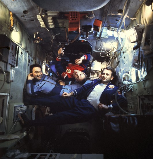 Soviet cosmonauts georgi grechko, vladimir dzhanibekov, and oleg makarov aboard the salyut 6 space station, docked with soyuz 26 and 27, 1978.