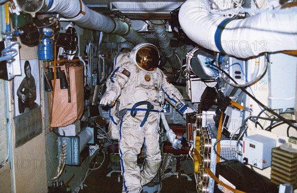 Soviet cosmonaut musa manarov aboard the mir space station, soyuz tm-4, 1988.