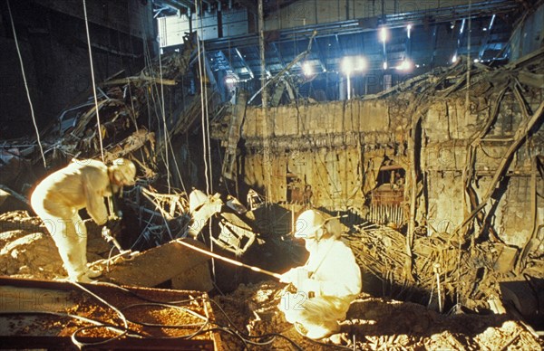 Chernobyl aps, ukraine, ussr, inspectors inside the sarcophagus of the unit 4 reactor 5 years after the accident, march 1991.