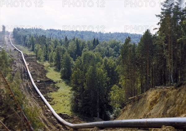 A section of the natural gas pipeline 'yamburg-yelets-1' running through the siberian taiga, 1990s.