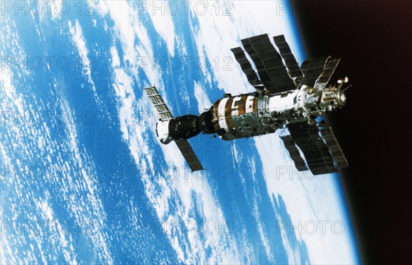 A soviet soyuz spacecraft docked to the salyut 7 space station.