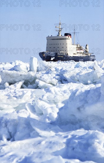 Soviet nuclear powered icebreaker, the admiral makarov, crushing her way through 1 meter thick ice in the sea of okhotsk, 1983.