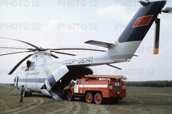 A truck being loaded onto a soviet mi-26 helicopter - the world's biggest, 1991.