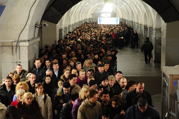 Moscow, russia, march 29, 2010, crowds of commuters walk past a sealed-off area in park kultury metro station, sokolnicheskaya line of the moscow underground, an explosion rocked the metro station at 8,40 during the rush hour killing more than ten passengers.
