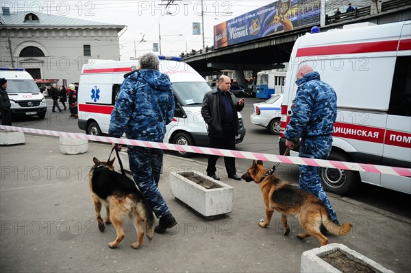 Moscow, russia, march 29, 2010, dog handlers and ambulances outside park kultury metro station, sokolnicheskaya line of the moscow underground, an explosion rocked the metro station at 8,40 during the rush hour killing more than ten passengers.
