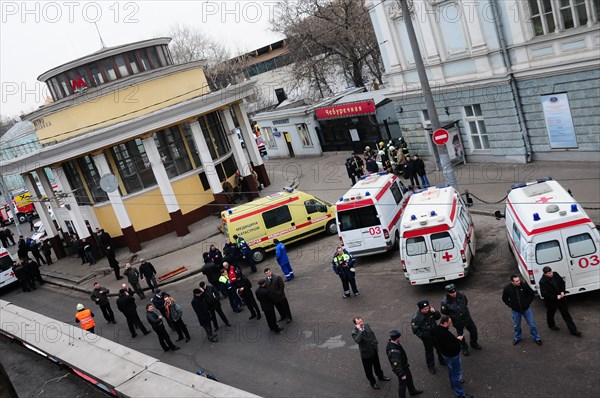 Moscow, russia, march 29, 2010, ambulances and police officers at an entrance to park kultury metro station, sokolnicheskaya line of the moscow underground, an explosion rocked the metro station at 8,40 during the rush hour killing more than ten passengers.