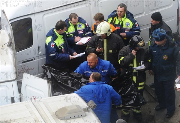 Moscow, russia, march 29, 2010, rescue workers carry the body of a bombing victim outside park kultury metro station, sokolnicheskaya line of the moscow underground, an explosion rocked the metro station at 8,40 during the rush hour killing more than ten passengers.