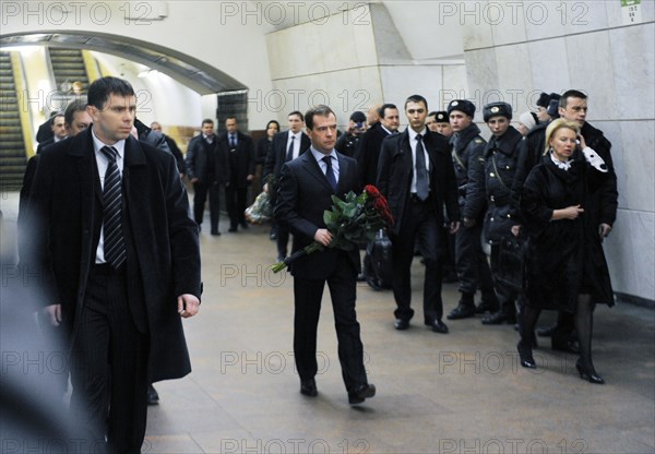 Moscow, russia, march 29, 2010, president of russia dmitry medvedev (?) lays flowers at lubyanka moscow metro station, the scene of today's suicide bombing, blasts rocked two stations on sokolnicheskaya line of the moscow underground during the rush hour killing 38 and injuring over 60 passengers.