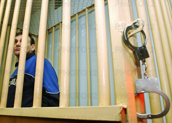Moscow, russia, may 19, 2004, former federal security service colonel mikhail trepashkin (left) seen in the dock as moscow military district court sentenced him to four years in prison.