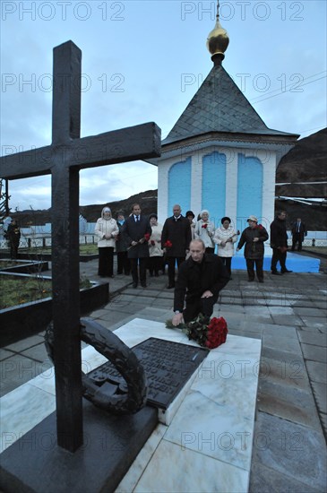 Norilsk, russia, august 31, 2010, prime minister vladimir putin lays flowers at the 'norilsk golgotha' memorial commemorating prisoners of norillag, norilsk corrective labour camp.