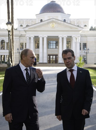 Moscow region, russia, october 1, 2010, president of russia dmitry medvedev (r) and prime minister vladimir putin chat during a walk at gorki residence.