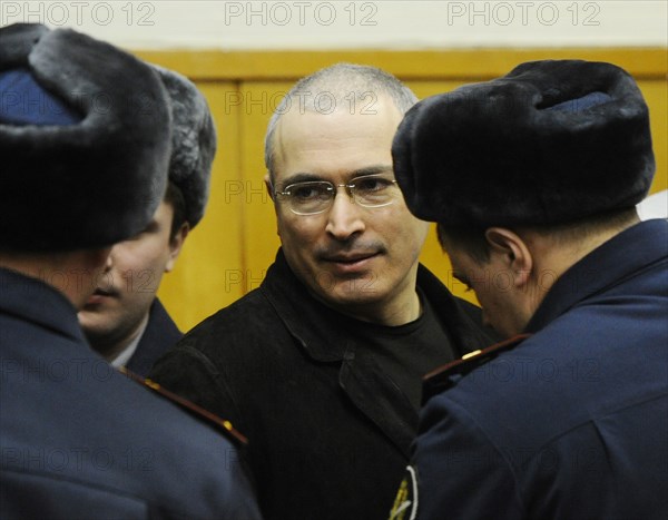 Moscow, russia, december 27, 2010, former yukos chief mikhail khodorkovsky (c) appears at the khamovniki district court, the court is expected to issue its ruling on the second case against the former yukos boss and his business partner, former menatep bank chief platon lebedev, the two men have been found guilty of stealing more than 200m tonnes of oil from yukos subsidiaries.