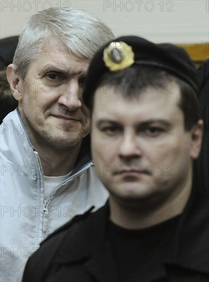Moscow, russia, december 30, 2010, former menatep bank chief platon lebedev (background) appears in the khamovniki district court, lebedev and ex-yukos chief mikhail khodorkovsky were found guilty of embezzling a large amount of oil and laundering of funds obtained in an illegal way and sentenced to 14 in a standard security penitentiary each, but this term incorporates the time both have been behind bars under the previous sentence.