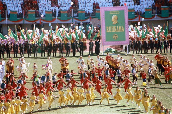 A theatrical performance at the olympic stadium in ashgabat celebrating the national flag day established in 1995 and the birthday of saparmurat niyazov 'turkmenbashi' president of turkmenistan who turns 65, february 20, 2005.