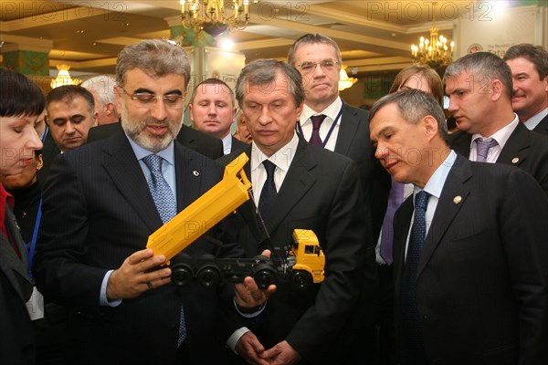 Kazan, russia, march 4, 2011, turkish energy minister taner yildiz, russian vice-prime minister igor sechin, and the head of tatarstan's regional government, rustam minnikhanov, (l-r front) view a model tipper truck at the 11th meeting of the russian-turkish interstate commission for trade and economic cooperation, the talks discussed gazprom's participation in the samsun-ceyhan pipeline project.