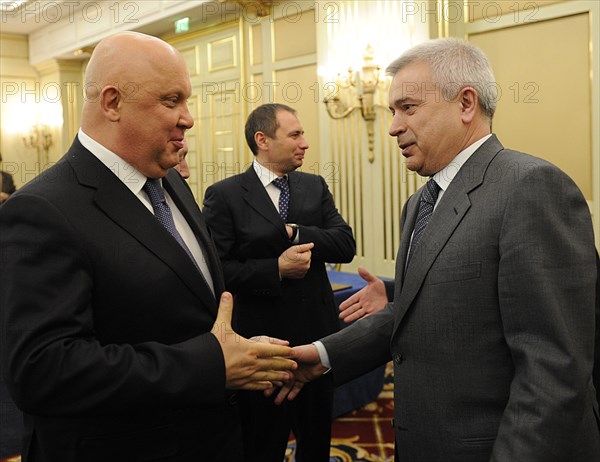 Moscow, russia, april 15, 2011, alexander goncharuk, chairman of the board at bashneft, left, and lukoil chairman vagit alekperov (r) chat after the signing of a letter of intent between bashneft and lukoil to jointly develop trebs and titov oil fields, according to the letter of intent, bashneft, who holds a licence for the two arctic oil fields, is to sell a 25,1 percent stake in the project to lukoil for 4,7bn roubles.