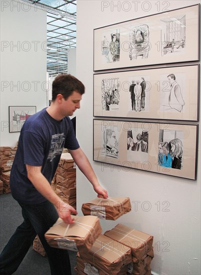 Moscow, russia, may 24, 2005, a stand with drawings made by pavel shevelev during a trial of mikhail khodorkovsky and platon lebedev, drawings on khodorkovsky-lebedev trial are exhibited in the kovcheg gallery within the framework of the 'art moscow' exhibition opened in the central house of painter.