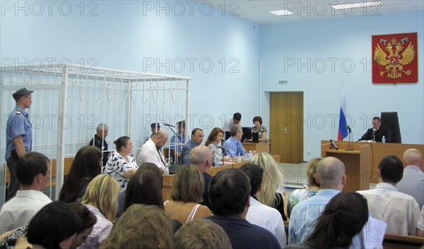 Velsk, arkhangelsk region, russia, july 26, 2011, former director of the menatep company platon lebedev (background l) appears in the dock as the velsk district court in the arkhangelsk region began to review his petition for parole.