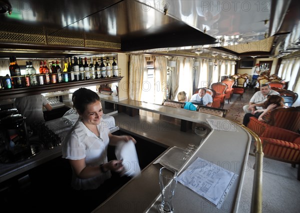 Moscow, russia, august 16, 2011, bar tender in a diner car on a moscow-to-beijing passenger train