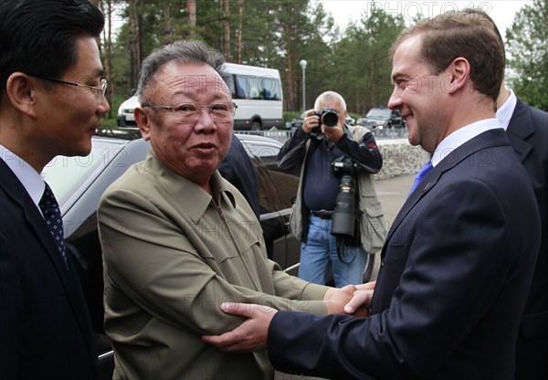Ulan-ude, russia, august 24, 2011, russia's president dmitry medvedev (r) welcomes kim jong-il (kim jong il), the leader of the democratic people's republic of korea (north korea), the chairman of the national defense commission, general secretary of the workers' party of korea, in ulan-ude.