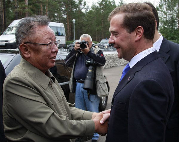 Ulan-ude, russia, august 24, 2011, russia's president dmitry medvedev (r) welcomes kim jong-il (kim jong il), the leader of the democratic people's republic of korea (north korea), the chairman of the national defense commission, general secretary of the workers' party of korea, in ulan-ude.