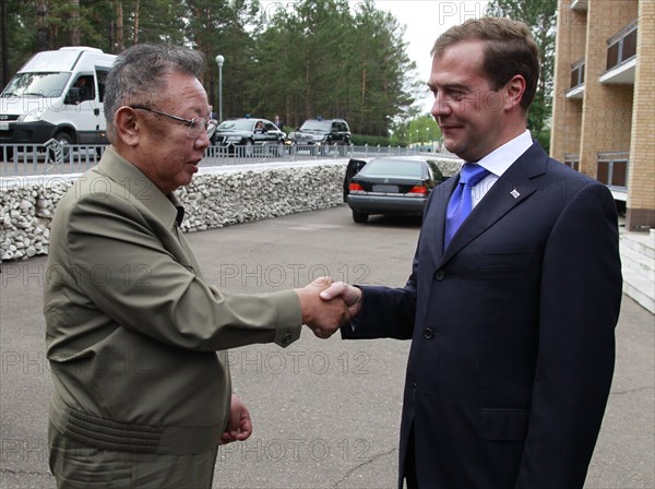 Ulan-ude, russia, august 24, 2011, russia's president dmitry medvedev (r) welcomes kim jong-il (kim jong il), the leader of the democratic people's republic of korea (north korea), the chairman of the national defense commission, general secretary of the workers' party of korea, in ulan-ude.