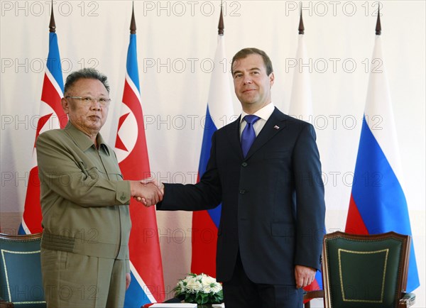 Ulan-ude, russia, august 24, 2011, russia's president dmitry medvedev (r) and kim jong-il (kim jong il), the leader of the democratic people's republic of korea (north korea), the chairman of the national defense commission, general secretary of the workers' party of korea, shake hands during a meeting in ulan-ude.