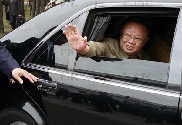 Ulan-ude, russia, august 24, 2011, kim jong-il (kim jong il), the leader of the democratic people's republic of korea (north korea), the chairman of the national defense commission, general secretary of the workers' party of korea, waves from his car after a meeting with russia's president dmitry medvedev at sosnovy bor (pine tree forest) military post in ulan-ude.