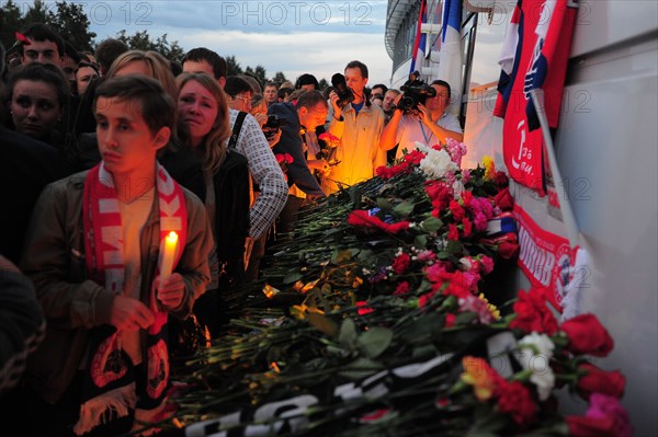 Yaroslavl, russia, september 7, 2011, lokomotiv yaroslavl fans lay flowers outside arena-2000 stadium to commemorate players of a khl ice hockey team lokomotiv who died in a yak-42 passenger plane crash in the yaroslavl region earlier this day.