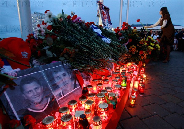 Minsk, belarus, september 9, 2011, people lay flowers and light candles outside minsk-arena stadium to commemorate hc lokomotiv yaroslavl team players who died in a plane crash on september 7, a khl game lokomotiv vs, dinamo minsk was due to take place here on september 8.