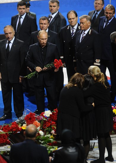 Yaroslavl, russia, september 11, 2011, prime minister vladimir putin (3rd l), rzd russian railways president vladimir yakunin (3rd r) attend farewell ceremony for the lokomotiv ice hockey players killed in a plane crash on september 7.