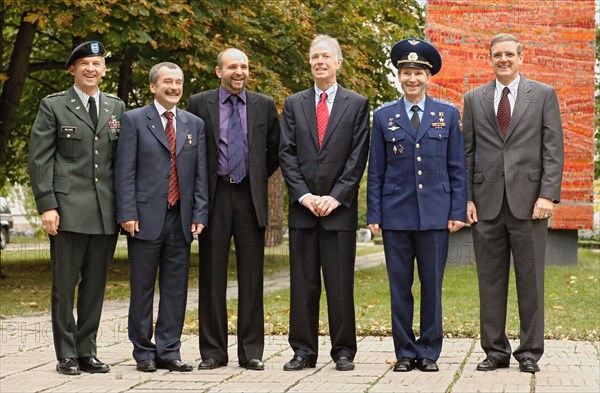 Moscow region, russia, september 18, 2005, members of the backup crew of the 12th expedition to international space station (iss), commander, us astronaut geoffrey williams, flight engineer mikhail tyurin, space adventures' moscow-based vice president sergey kostenko and members of the main crew, space tourist gregory olsen, flight engineer, russian cosmonaut valery tokarev and commander, nasa astronaut william mcarthur (l-r) pose for a photo as before leaving star city for baikonur cosmodrome.