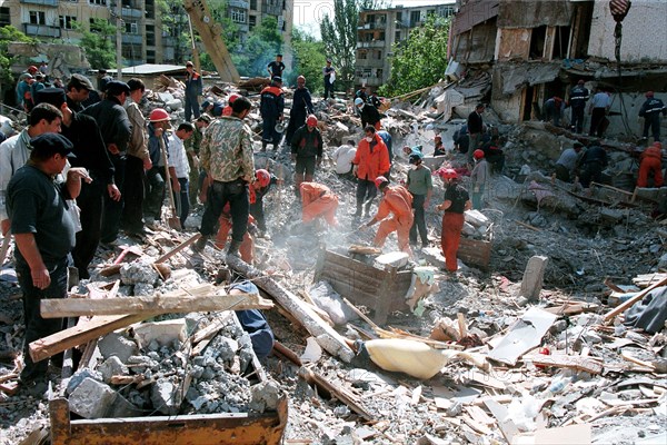 Makhachkala, russia, september 7, 1999, the death toll from a blast in a 5-storey dwelling house in the daghestani town of buinaksk occurred on sept,4, has reached 61, however, this figure is not final as the clearing the debris is still in progress (ops), the list of casualties includes 21 children and 18 women, ten victims have not yet been identified, altogether 145 people were injured by the blast.
