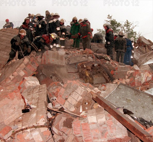 Moscow,russia, september 13, 1999, rescuers shown working at the rubble of the apartment block that was blasted last night on moscow's kashirskoye shosse, southeasteen municipal district, here on monday, twenty-two bodies, including of two children, have been recovered as of 8,30 a,m, moscow time from the debris,nine people have been hospitalised with injuries, the eight-storey apartment block was built in 1959, preliminary information suggests that its basement was leased to somebody.