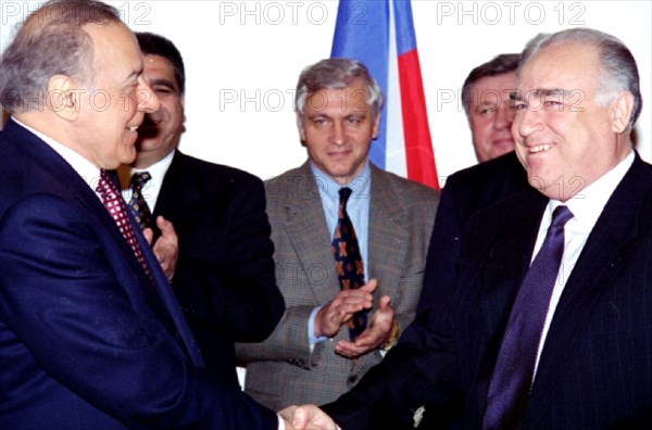 Russian premier victor chernomyrdin and president geidar aliyev of azerbaijan shake hands and smile during the meeting in the house of government jan,18, as a result of the intergovernmental talks an agreement on transportation of azerbaidjani oil in the baku-novorossllsk pipe-line has been signed, 1996.