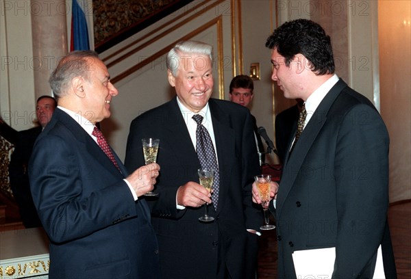 Presidents boris yeltsin of russia /in centre/ and geidar aliyev of azerbaijan /left/ paying an official visit to russia, and first vice-premier of the russian government boris nemtsov are pictured smiling and drinking a toast after a signing ceremony for a basic treaty of friendship, cooperation and security in the kremlin on jul,3rd, along with the treaty, signed at summit level, another five documents were signed in the kremlin in the presence of the heads of state, 1997.