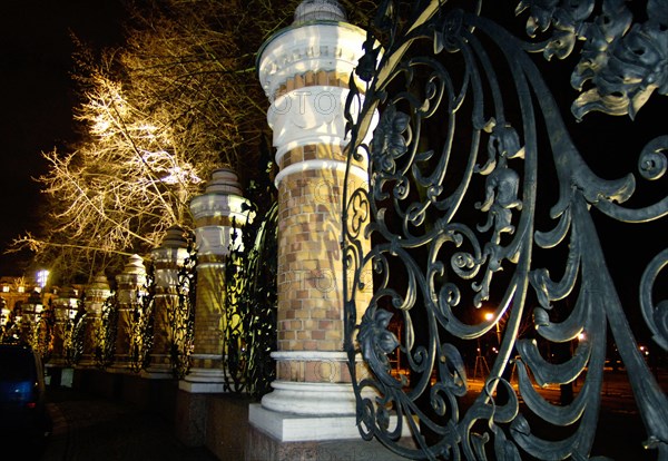 St,petersburg, russia, december 01, 2005, the graceful and impressive wrought-iron fence surrounding mikhailovsky garden gets a new architectural lighting designed by italian piero castiglioni as well as the savior on the spilled blood cathedral.