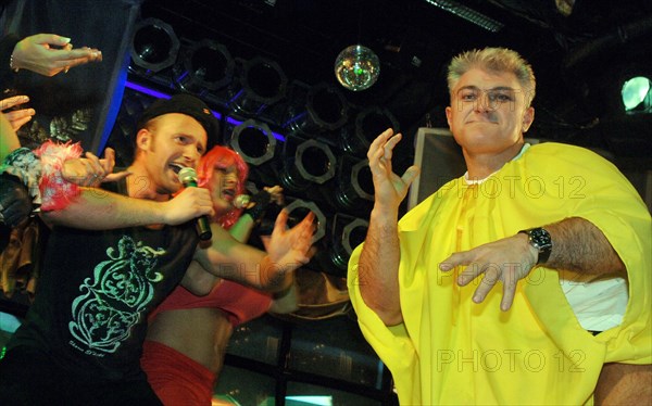 Tv presenter, athlete vladimir turchinsky (r) marks his birthday in the slava night entertainment center, december 5, 2005.