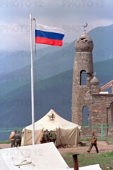 This minaret near the settlement of tuskhoroi in the argun gorge was a part of the ancestral estate of yandarbiyev, one of the leaders of chechen rebels, now the military tents are put there to accomodate temporarily border guards of the itum-kalinsky detachment of the federal border guard service, chechnya, russia, june 28, 2000.
