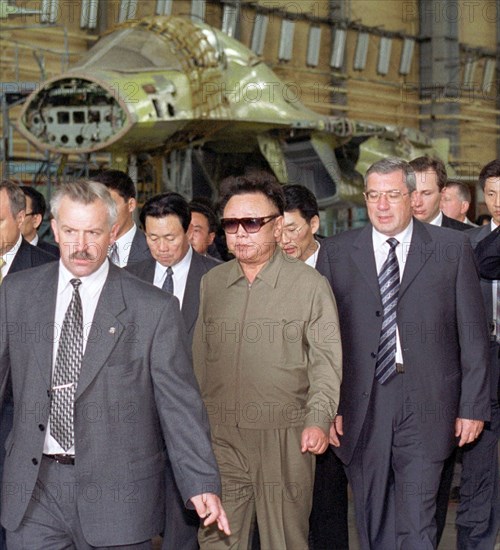 Novosibirsk, russia, august 11, 2001, the north korean leader kim jong il (c) who arrived in novosibirsk on saturday pictured visiting the the assembly shop of the su-34 most modern fighter-bombers at the chkalov aircraft manufacturing association, after a tour of the company, he was shown combat capabilities of a su-24 fighter- bomber.