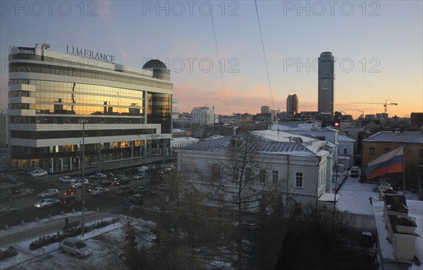 Yekaterinburg, russia, november 28, 2011, night view of vysotsky business centre, a 54 storey skyscraper (far) and 'limerence' shopping center (l).