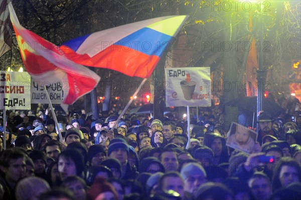 Moscow, russia, december 5, 2011, demonstrators wave flags during an opposition protest in central moscow against alleged vote-rigging in the december 4 parliamentary election.