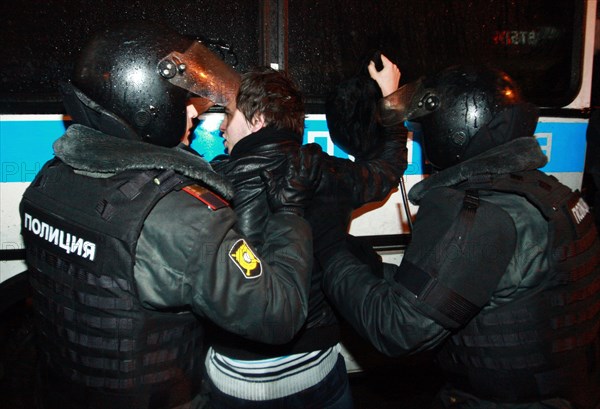 Moscow, russia, december 5, 2011, police detain demonstrators during an opposition protest in central moscow against alleged vote-rigging in the december 4 parliamentary election.