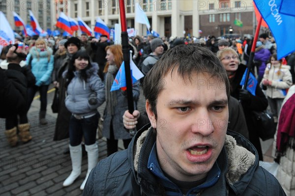 Moscow, russia, december 12, 2011, young demonstrators chant slogans during a rally staged by pro-kremlin youth groups in central moscow, the event took place two days after a mass protest against alleged vote rigging in the 4 december parliamentary election.