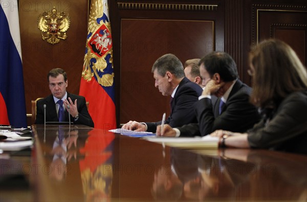 Moscow region, russia, december 13, 2011, president of russia dmitry medvedev, deputy prime minister in charge of preparation for sochi winter olympic games 2014 dmitry kozak, presidential aide arkady dvorkovich and economy minister elvira nabiullina (l-r) attend a meeting on the delimitation of powers between the bodies of authority, at gorki residence.
