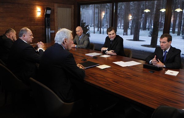 Moscow region, russia, december 13, 2011, president of russia dmitry medvedev, deputy kremlin chief of staff, vladislav surkov, leader of the ldpr party's state duma faction igor lebedev (background r-l), state duma speaker boris gryzlov, leader of russia's communist party, gennady zyuganov and leader of the liberal-democratic party (ldpr) vladimir zhirinovsky (foreground r-l) hold a meeting at gorki residence.