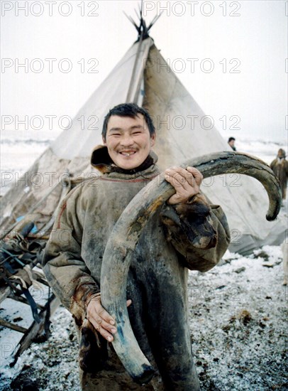 Viktor yarotsky holds a mammoth tusk weighing 12 kg which was found near the yara-tanam river, taimyr residents quite often find remains of the prehistorical animals, mammoth ivory is used by local masters of carving for creating various items, tsaimir, russia, october 7.