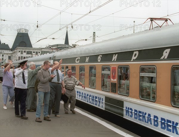 Moscow, russia, july 9, 2001, friends and relatives seeing off passengers of the special train, which headed from moscow's yaroslavsky terminal to vladivostok, on monday, the train marks the 100th anniversary of the trans-siberian railway.